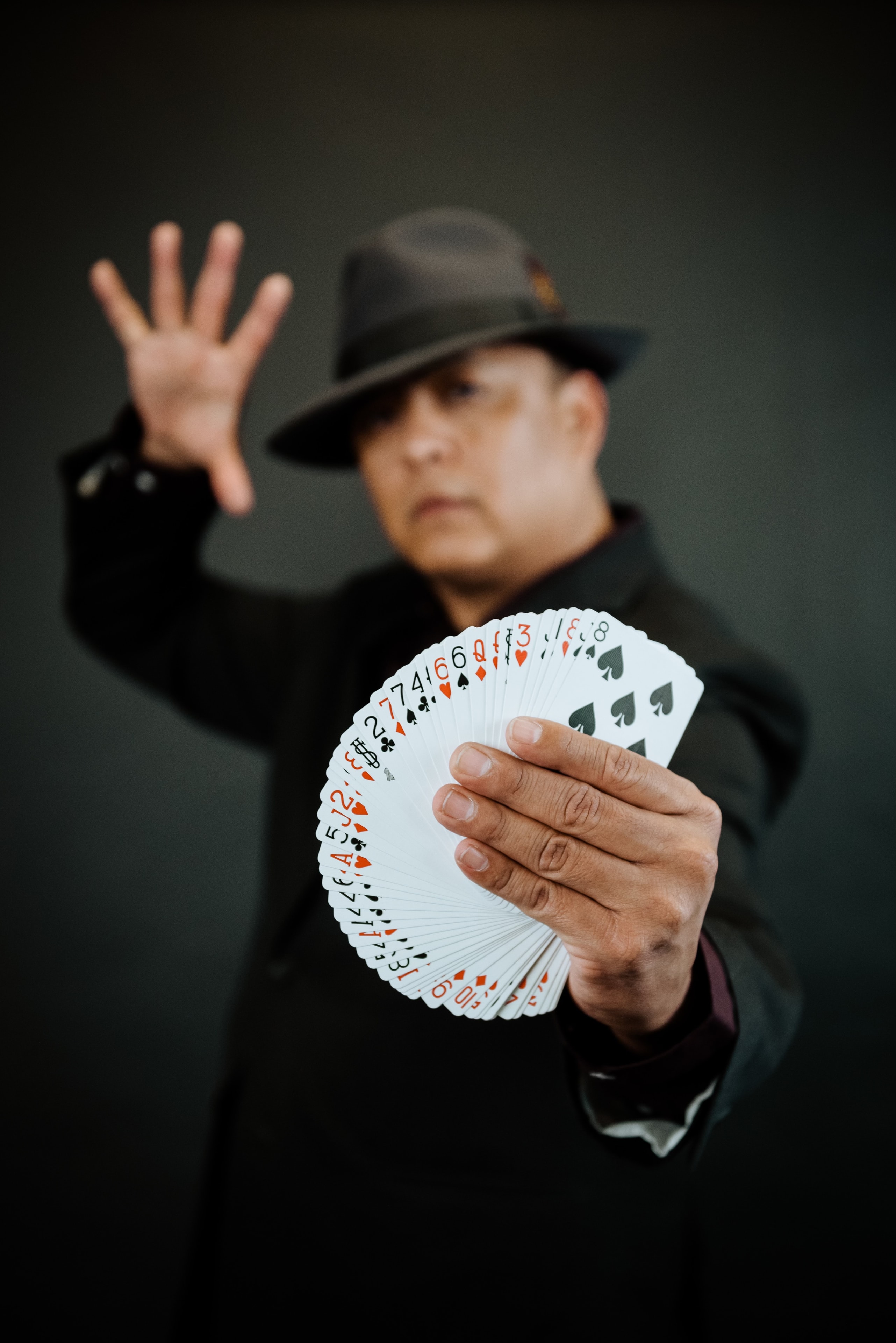 Brian Yazzie fanning a deck of cards